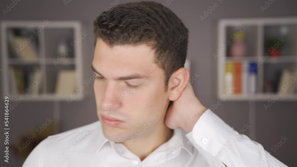 Man with headache rubs his head. Man with headache rubbing his head