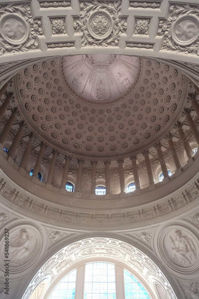 Breathtaking architecture details of panoramic dome columns scenic building interior view with historic walls, chandeliers, brass railings, marble statues in public city hall landmark