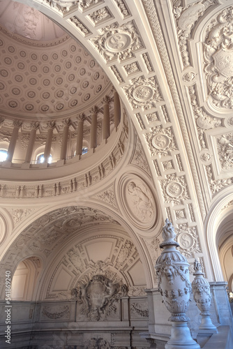 Breathtaking architecture details of panoramic dome columns scenic building interior view with historic walls  chandeliers  brass railings  marble statues in public city hall landmark