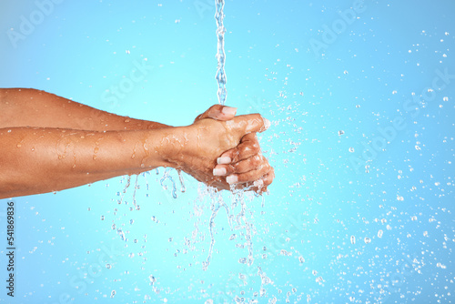 Hands, water and wash for clean hygiene, health or wellness against a blue studio background. Hand rinsing, washing or cleaning for fresh hygienic cleanse or hydration in care for skin on mockup