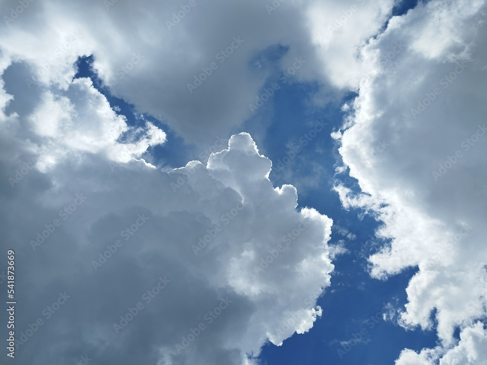Big fluffy clouds, Cumulus are the puffy, white, cotton-top clouds with Sunbeams Clouds, Sunlight behind the clouds. Light from heaven Big fluffy clouds, Cumulus are the puffy, white, cotton-top clouds with Sunbeams Clouds, Sunlight behind the clouds. Light from heaven