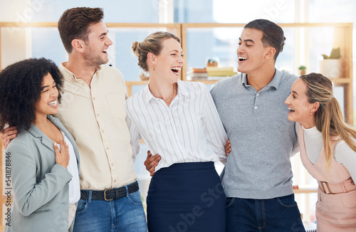 Office, diversity and group of business people hug for team building, teamwork and collaboration. Happy, smile and staff members embrace together for motivation, goals or vision in company workplace.