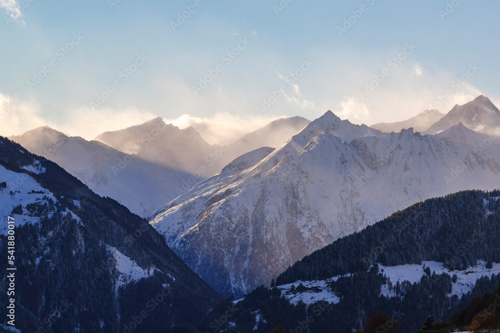 Scenic view at snow capped mountain peaks