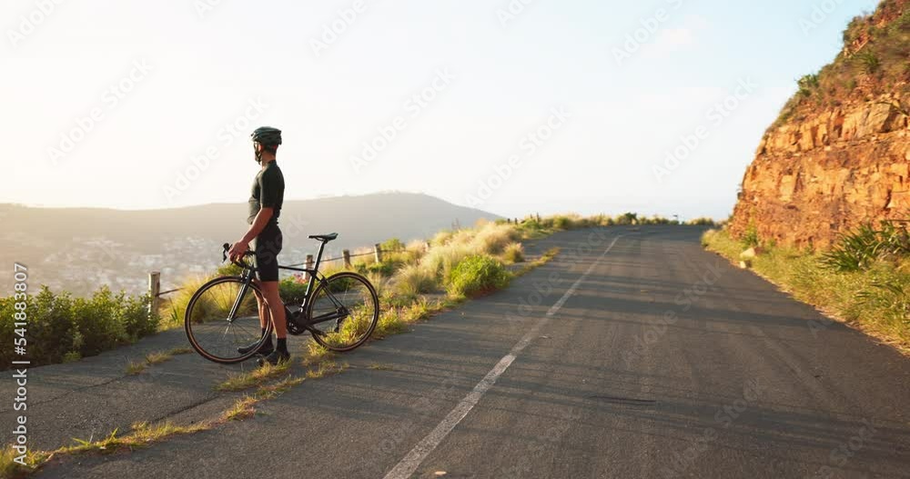 Man, bicycle and fitness, celebrate on the road, cyclist excited and winner with arms raised, success while training outdoor. Bike, cycling and exercise, athlete at sunrise, healthy and active life. Man, bicycle and fitness, celebrate on the road, cyclist excited and winner with arms raised, success while training outdoor. Bike, cycling and exercise, athlete at sunrise, healthy and active life.