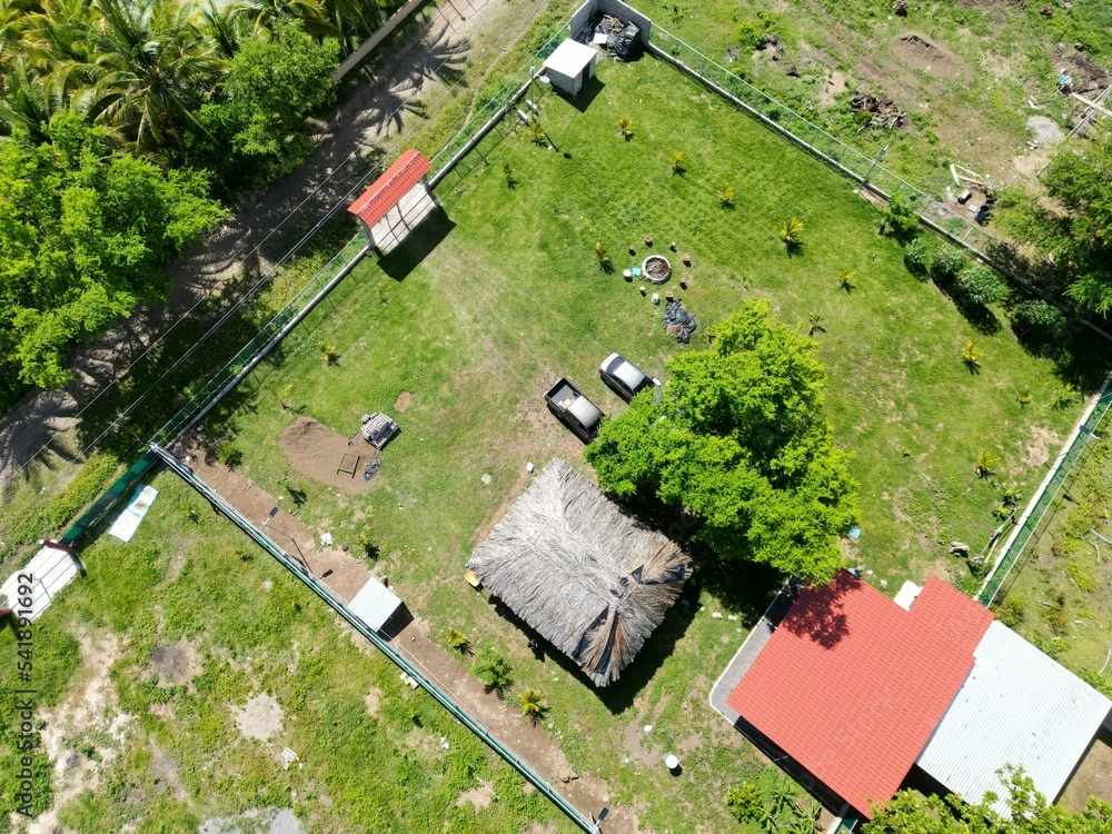 Drone view of resort houses in the green Playa El Espino beach