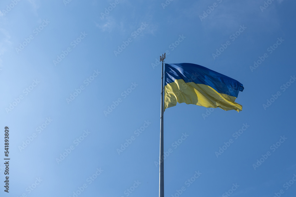 National flag of Ukraine against blue sky National flag of Ukraine against blue sky