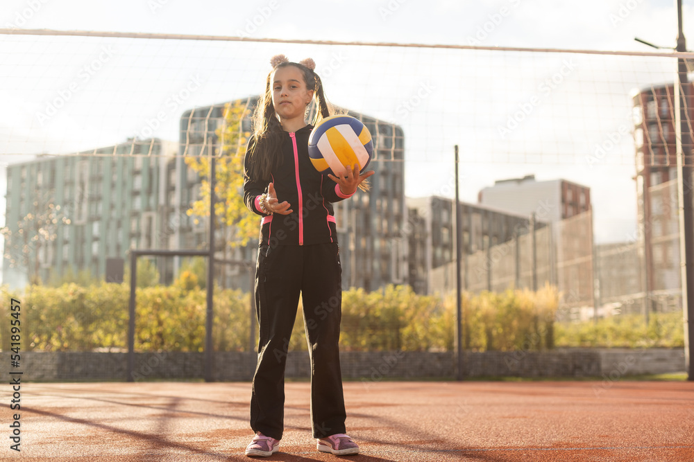 Pretty teen girl with brunette hair, volleyball ball Stock Photo ...