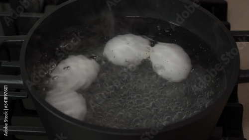 Boiling eggs on a gas stove. Top view close-up.