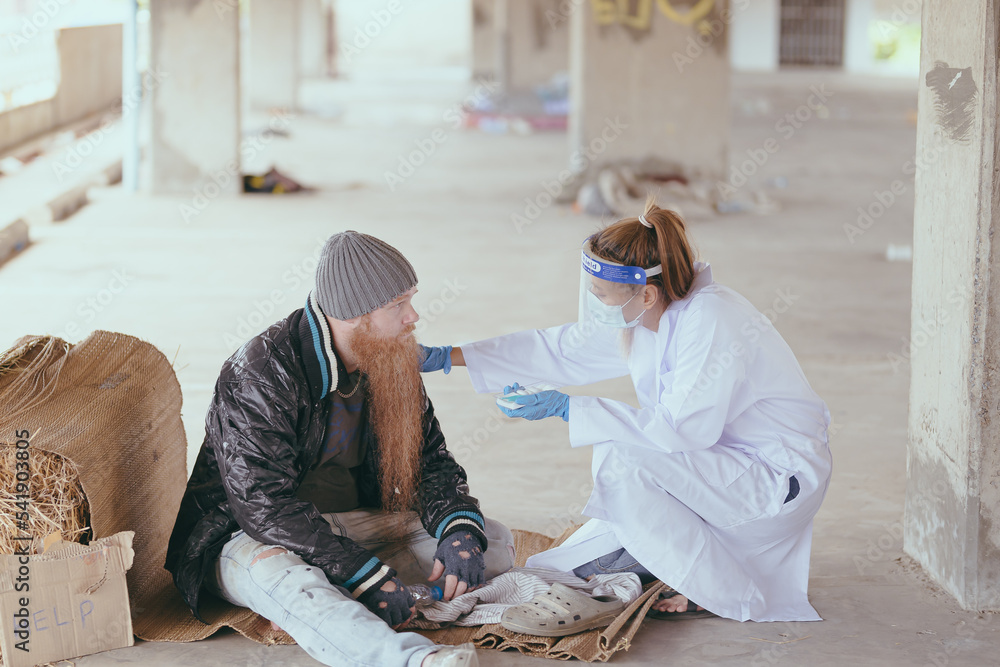 Health workers provide assistance to the homeless. homeless poor people depression Help and hope concept. Health workers provide assistance to the homeless. homeless poor people depression Help and hope concept.