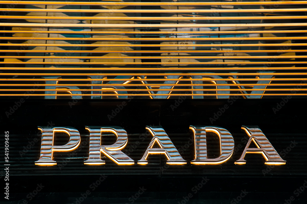 Logotype logo sign of Prada is italian luxury fashion brand at wall of  store. White logotype Prada brand at wall of store in shopping mall. Close  up Stock Photo | Adobe Stock