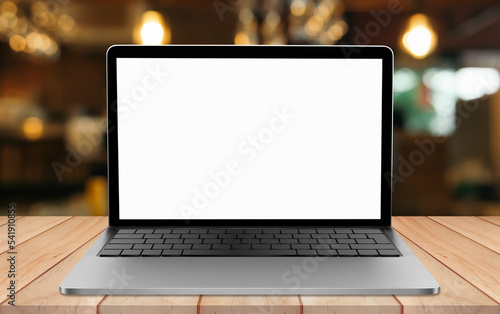 Laptop blank screen on table with blur coffee shop background
