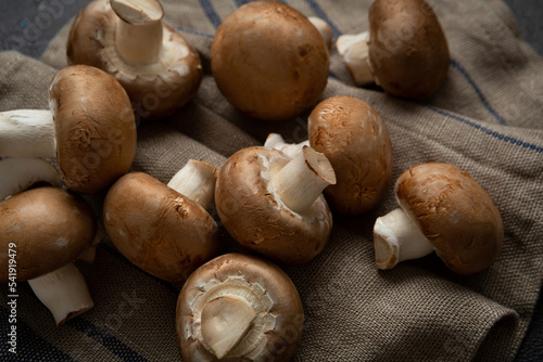 Raw fresh shiitake mushrooms on kitchen textile vegan food