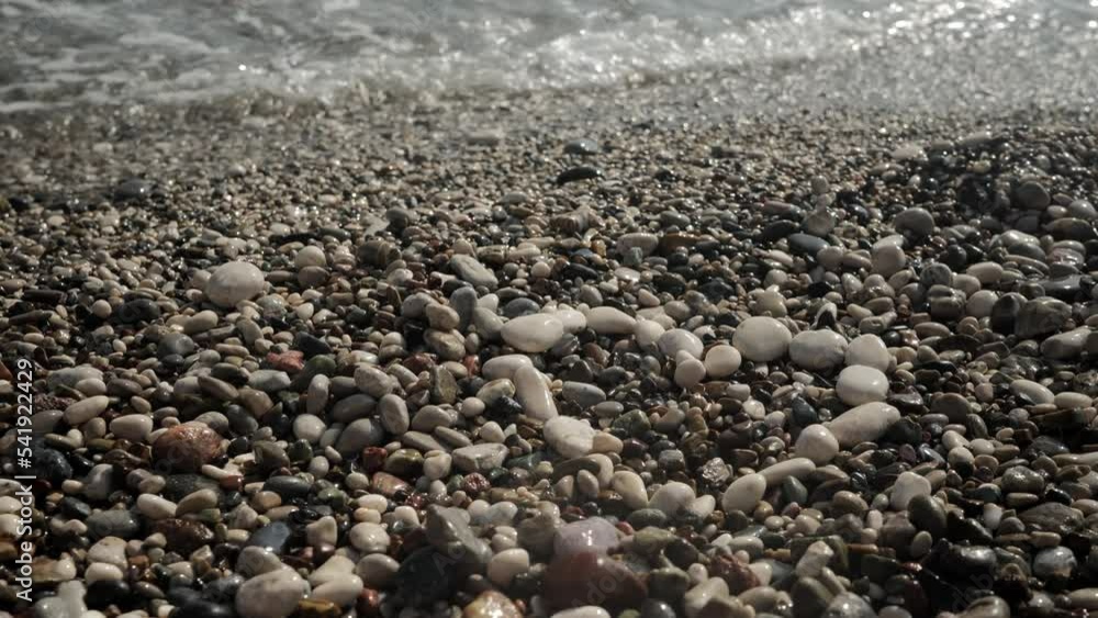 Laid out figure of a heart from white stones on a small-stony seashore. The wave reaches the heart. High quality 4k footage Laid out figure of a heart from white stones on a small-stony seashore. The wave reaches the heart. High quality 4k footage