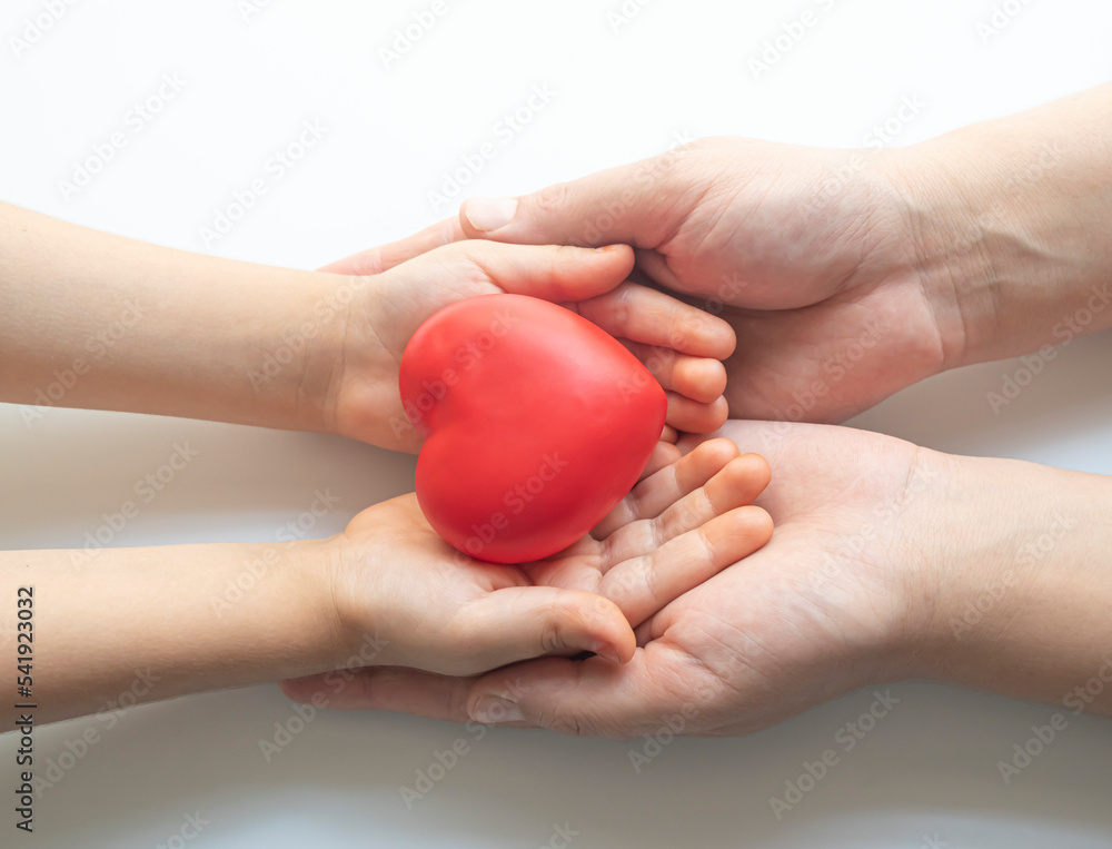 boy holding white heart in palm. Organ donation and insurance concept. World heart health concept. World organ donation day. Concept of healthy heart for healthy life. selective focus - obrazy, fototapety, plakaty 