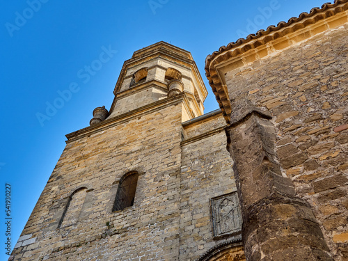 Close-up of the stone wall and tower of the Cathedral of Baeza, in Spanish: Catedral de la Natividad de Nuestra Señora. Province of Jaen, Andalusia, Spain photo
