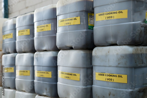stock of used cooking oil in jerry cans.  used cooking oil collectors to reduce environmental pollution from household waste to be recycled into biodiesel raw materials
