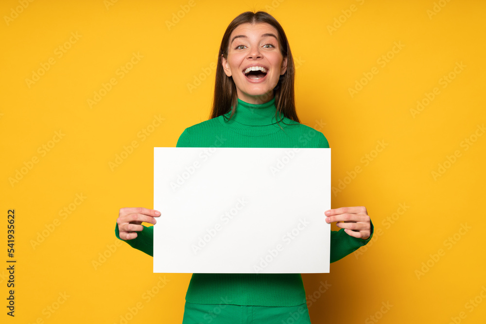 Excited surprised student girl holding paper sheet with special offer for education program abroad Excited surprised student girl holding paper sheet with special offer for education program abroad