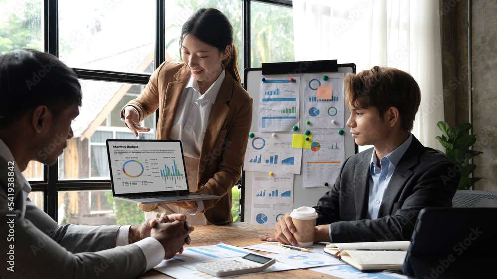 Fototapeta premium Asian business adviser meeting to analyze and discuss the situation on the financial report in the meeting room.Investment Consultant, Financial advisor and accounting concept