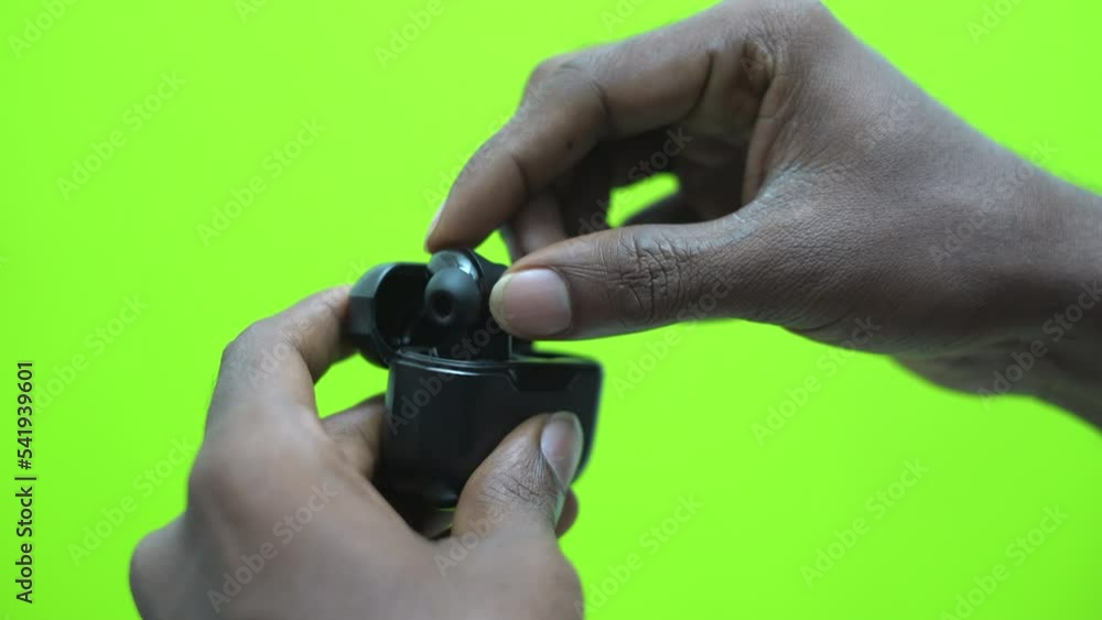closing buds case black with hand green background closing buds case black with hand green background