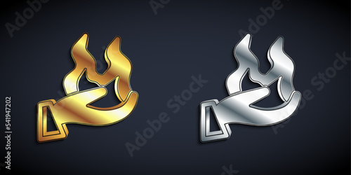 Gold and silver Hand holding a fire icon isolated on black background. Long shadow style. Vector