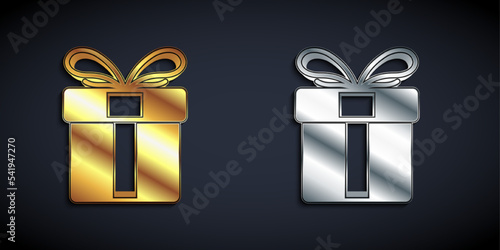 Gold and silver Gift box icon isolated on black background. Merry Christmas and Happy New Year. Long shadow style. Vector