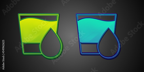 Green and blue Glass with water icon isolated on black background. Soda glass. Vector