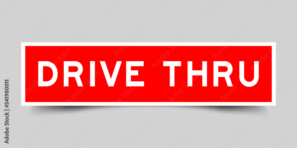 Sticker label with word drive thru in red color on gray background Sticker label with word drive thru in red color on gray background