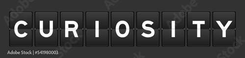 Black color analog flip board with word curiosity on gray background