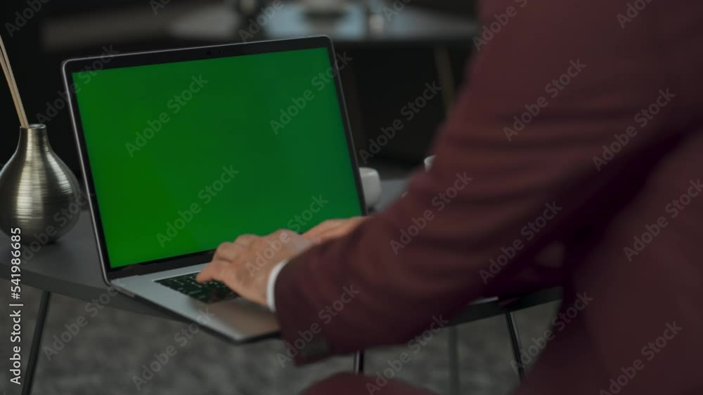 Closeup man arms texting green screen laptop at cabinet. Director using computer Closeup man arms texting green screen laptop at cabinet. Director using computer