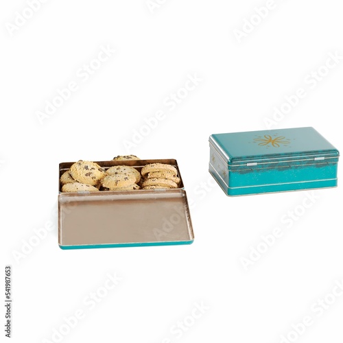 3D render of cookies in a metal box isolated on a white background