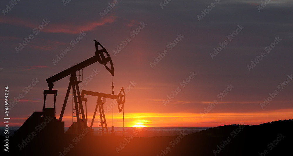 The change in oil prices caused by the war. Oil prices are rising because of the global crisis. Oil drilling derricks at desert oilfield. Crude oil production from the ground. Petroleum production.