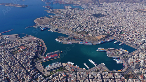 Aerial drone photo of famous and busy port of Piraeus where passenger ferries travel to Aegean destination islands as seen from high altitude, Attica, Greece photo