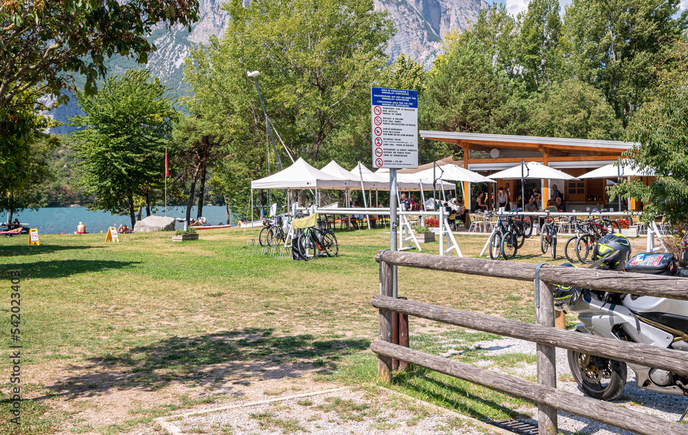 quiet shore at Lake Cavedine, a small lake in Trento province - Trentino Alto Adige - northern Italy, august 26, 2022 quiet shore at Lake Cavedine, a small lake in Trento province - Trentino Alto Adige - northern Italy, august 26, 2022