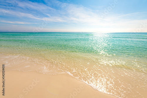 Shiny glitter shimmer waves with sun reflections on Gulf of Mexico ocean water with small ripples on sunny day at city of Miramar, Florida panhandle © Andriy Blokhin