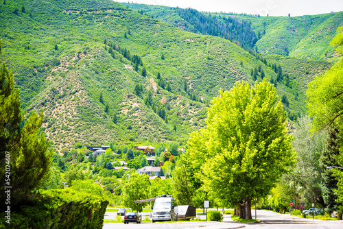 Glenwood Springs, Colorado residential street road in Colorado with houses homes on mountain with forest photo