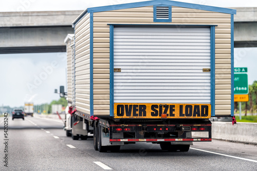 Wallpaper Mural Oversize over size load hauler truck trailer vehicle hauling mobile module home house on North Carolina interstate highway road Torontodigital.ca