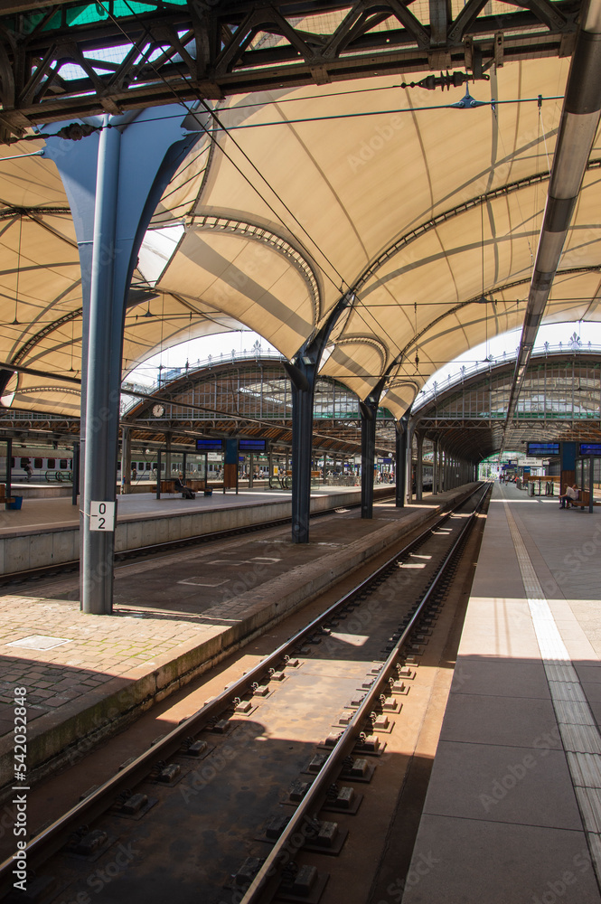 Railway station partially covered on a sunny day. Shade. Railway station partially covered on a sunny day. Shade.