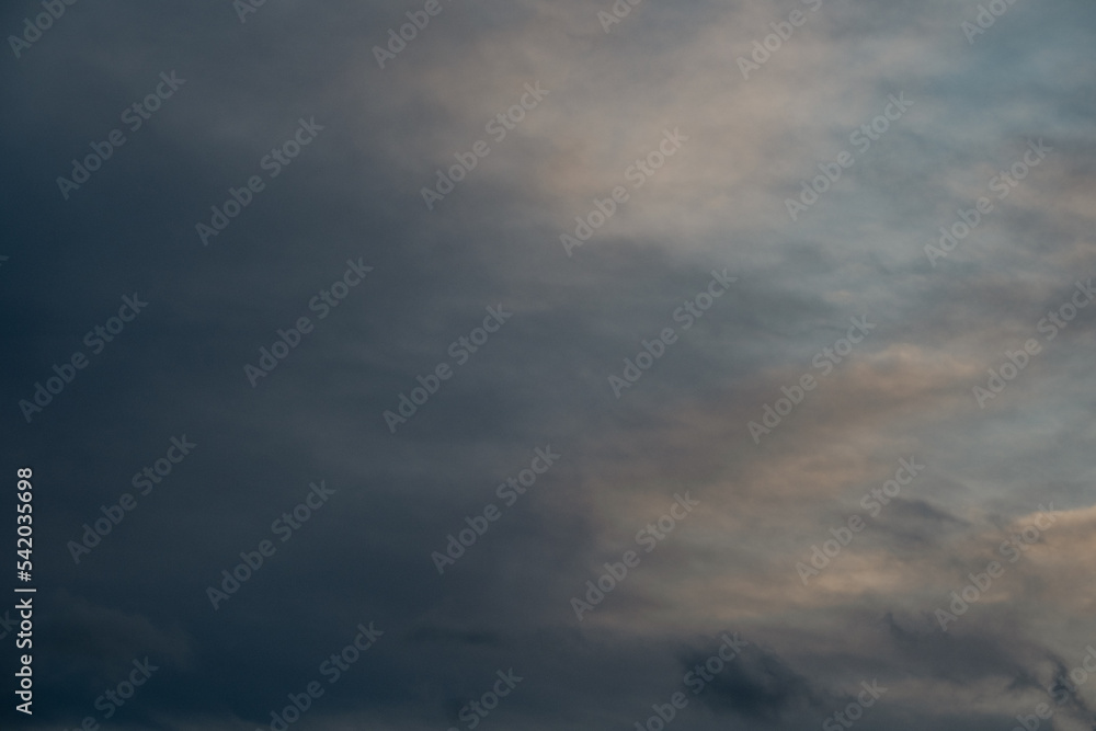 Dark blue stormy sky with clouds, abstract nature background