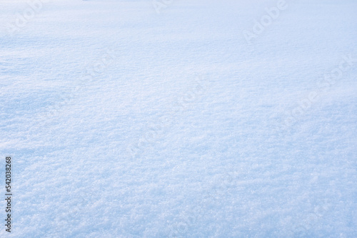 Light blue snow background. Fluffy snow texture for a poster, calendar, post, screensaver, wallpaper, postcard, banner, cover, website. High quality photo