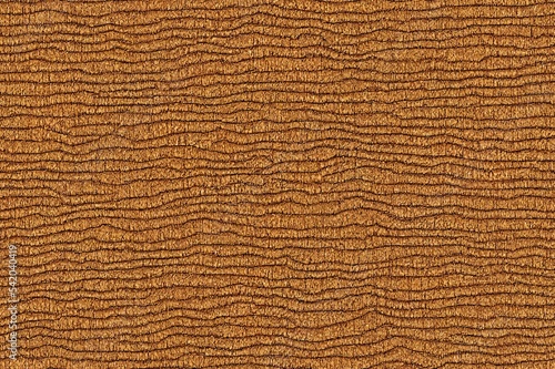 Light beige matte background of suede fabric, closeup. Velvet texture of seamless sand leather.