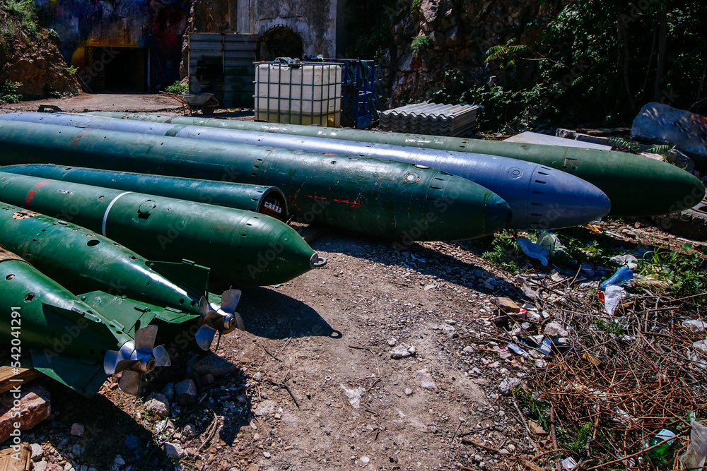 Green submarine torpedoes with propellers, close up view