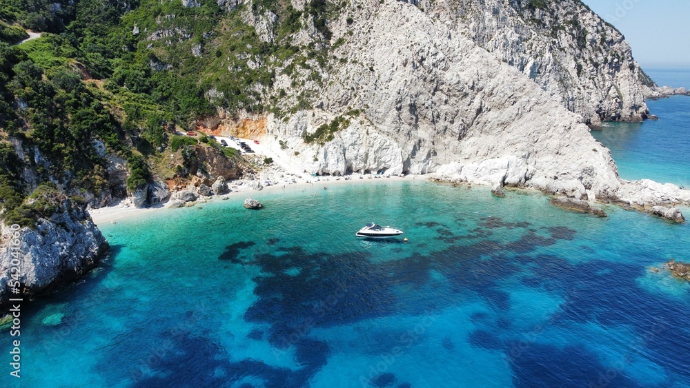 Fototapeta premium Drone shot of a boat near to the Agia Eleni rocky beach in Kefalonia Island, Greece