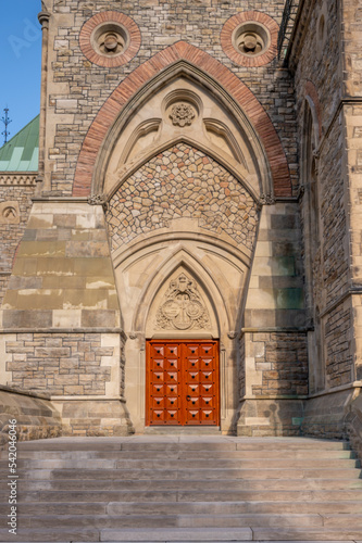 Ottawa, Ontario - October 19, 2022: Ornate Entrance to the East Block on Canada's Parliament Hill seen rising gracefully on a beautiful day. photo