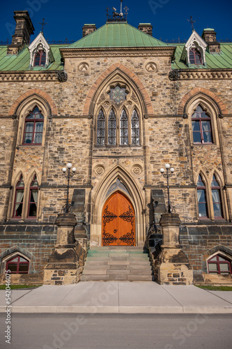 Ottawa, Ontario - October 19, 2022: Ornate Entrance to the East Block on Canada's Parliament Hill seen rising gracefully on a beautiful day.