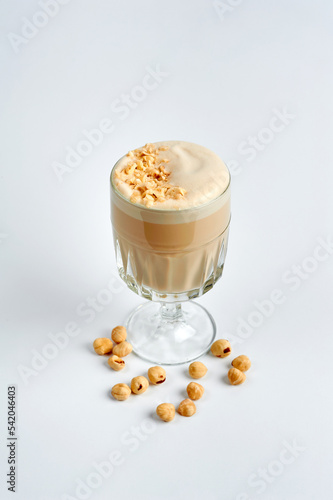 Raf coffee with nuts in a glass, white background