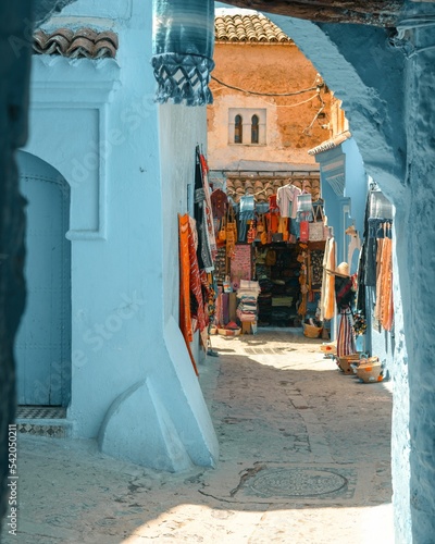 Narrow alley between beautiful blue-washed buildings in Chefchaouen, Morocco © Zakariae Daoui/Wirestock Creators