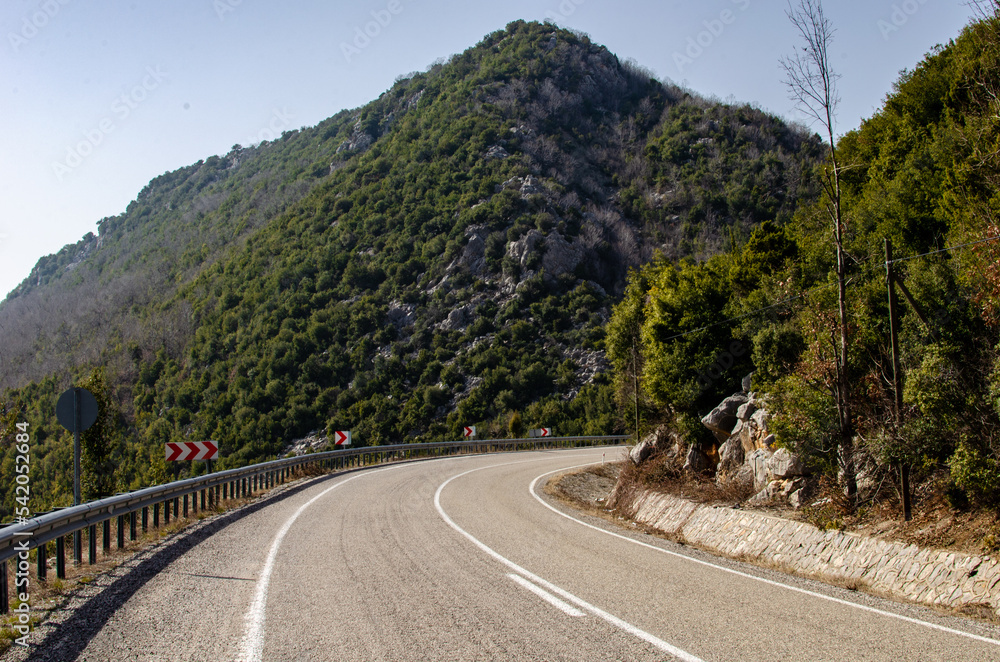 asphalt road through mountains