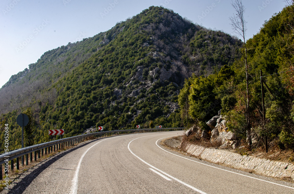 Fototapeta premium asphalt road through mountains