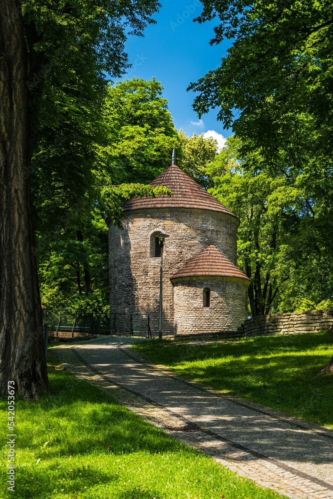 Vertical shot of a medieval rotunda at Castle Hill with an alley and trees around in Cieszyn, Poland Vertical shot of a medieval rotunda at Castle Hill with an alley and trees around in Cieszyn, Poland