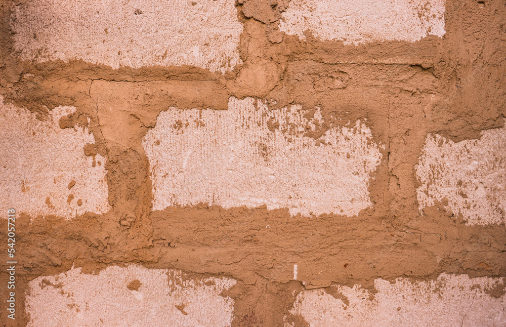 Abstract background from a brown wall made of blocks close-up. Abstract background from a brown wall made of blocks close-up.
